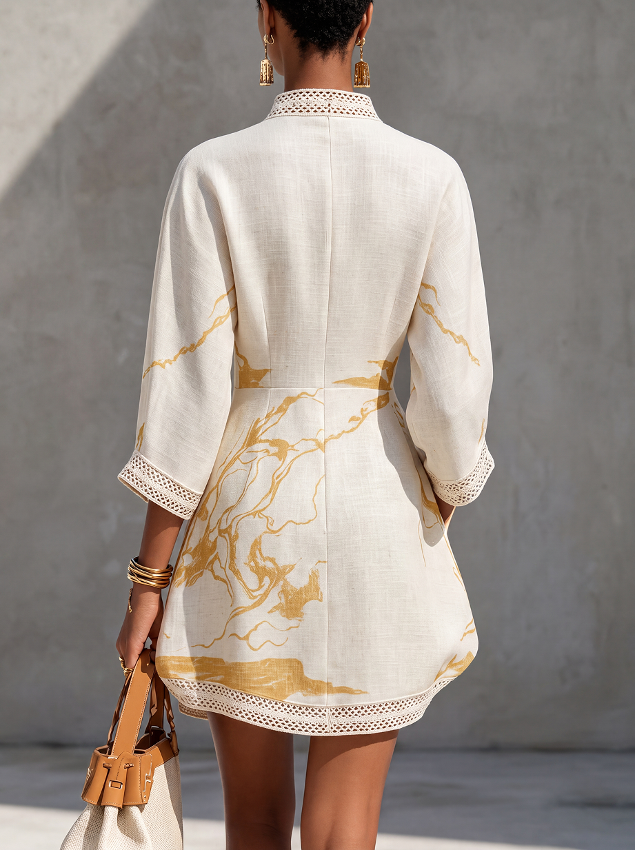 ALIENOR | Abito mini in pizzo all'uncinetto avorio con motivi dorati e scollatura a v