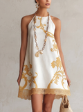 HÉLOÏSE | Abito mini in pizzo bianco con motivi dorati